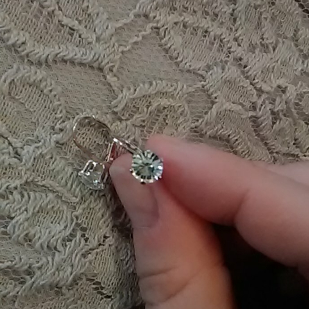 One carat cubic zirconia earrings.